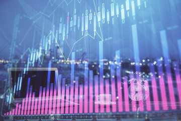 Forex market chart hologram and personal computer background. Multi exposure. Concept of investment.