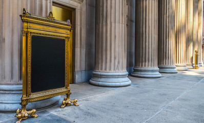 Golden table in front of pillars in the city
