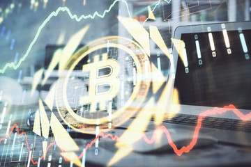 Multi exposure of blockchain theme hologram and table with computer background. Concept of bitcoin crypto currency.