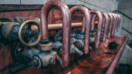 Traditional valves in a beer factory 