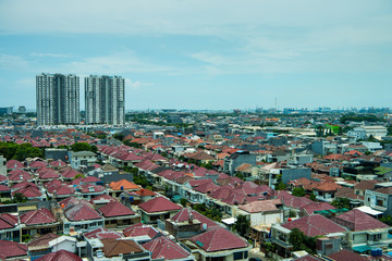Fototapeta premium Aerial view of downtown of Jakarta, with residential houses and modern buildings.