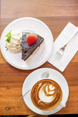 Cappuccino coffee and strawberry cake