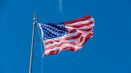 Waving USA flag on the mast