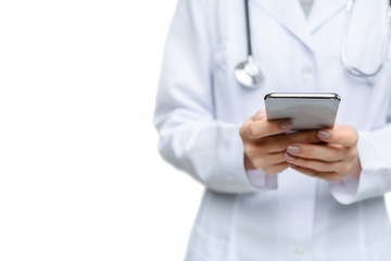Unrecognizable Female Doctor Using Smartphone Standing Over White Studio Background