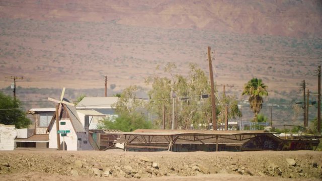 The famously apocalyptic looking town Bombay Beach seen behind a berm