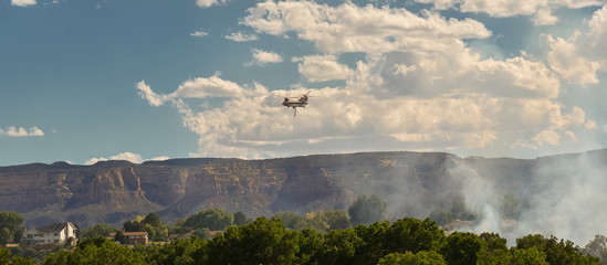 Helicopter Making Water Drops to Protect Homes