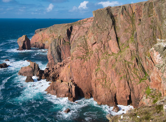 Sea cliffs near North Ham on Muckle Roe, Shetland, UK - the rock is of the Muckle Roe Intrusion -...
