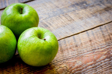 ripe green apples wooden table background space for text