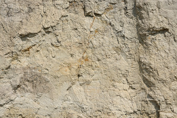 Obraz premium Texture of different layers of clay underground in a clay quarry. clay wall background close up