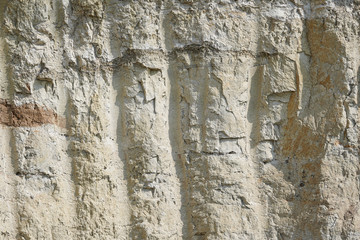 Texture of different layers of clay underground in a clay quarry. clay wall background close up