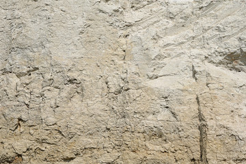 Naklejka premium Texture of different layers of clay underground in a clay quarry. clay wall background close up