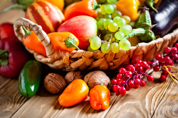 The table, decorated with vegetables and fruits. Harvest Festival. Happy Thanksgiving. Autumn background. Selective focus.