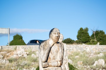 Fototapeta na wymiar .Image shows a wooden sculpture of a man placed at the National Park of Parnitha mountain Greece.