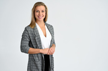 Close-up portrait of a cute caucasian blonde female student girl in a gray jacket on a white background. Wide smile, happiness. It is in different poses. - 293405348