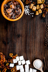 sugar lumps for sweet food cooking on kitchen wooden table top view mock up