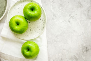 summer food with green apples on stone background top view mock up