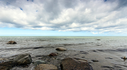 Wonderful beautiful impressive landscape near the famous white Chalk Cliffs on the isle of Rügen, Baltic Sea on a beautiful summer day with blue sky and clouds / Germany in Europe.