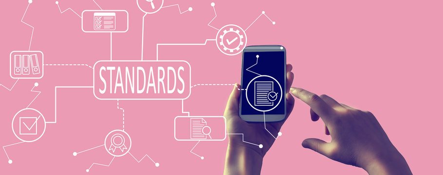 Standard quality control approval with person holding a white smartphone