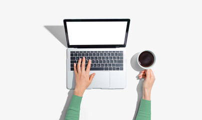 Person using a laptop computer from above