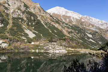 Fototapeta na wymiar Okoto (The Eye) Lake and Vihren Peak, Pirin Mountain