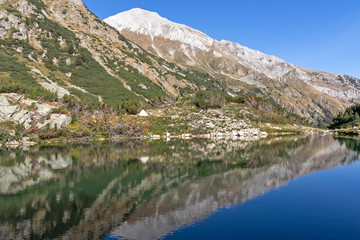 Fototapeta na wymiar Okoto (The Eye) Lake and Vihren Peak, Pirin Mountain