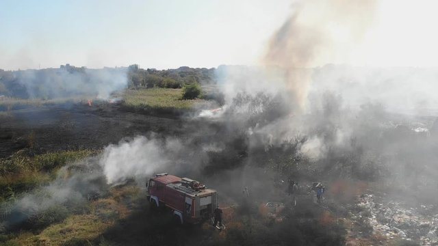 Fire truck in action Pollution Smoke Fire suburb aerial view slow motion