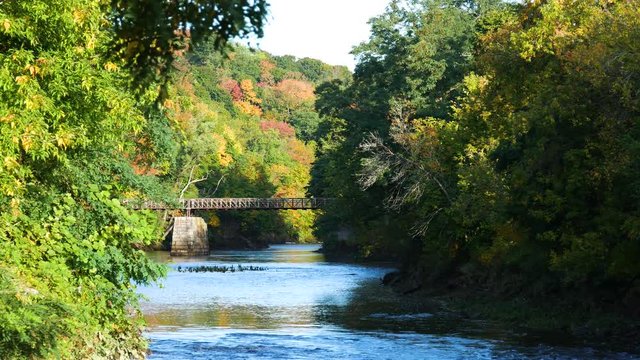 Video of the Kenduskeag River in early autumn with leaves falling at Bangor Maine.