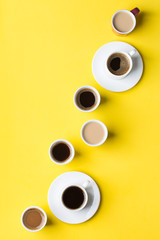 Creative flat lay with assortment of coffee cups