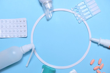 Frame with many pills and tablets on blue background