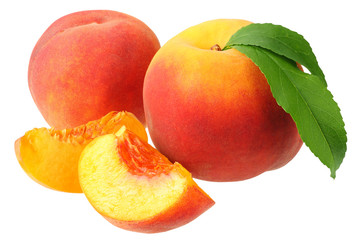 peach fruit with green leaves and slices isolated on white background