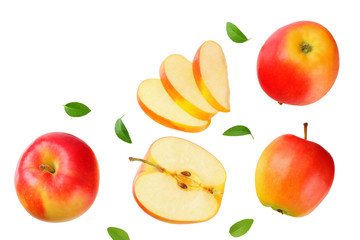 red apples with slices and green leaves isolated on a white background. top view