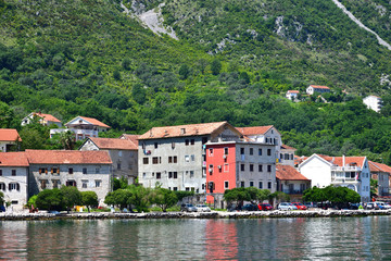 Fototapeta na wymiar View of the embankment of Prcanj from Kotor Bay, Montenegro