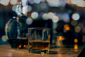 glass of beer on table at night