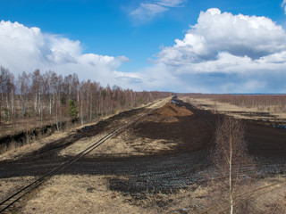 landscape with railway tracks in the bog, peat extraction bog 