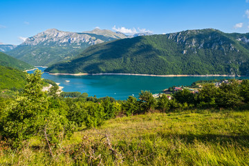 Fototapeta na wymiar Piva Lake (Pivsko Jezero) and Pluzine town view in Montenegro.