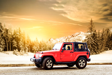 Red winter car and landscape of mountains 