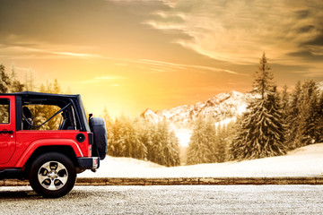 Red winter car and landscape of mountains 