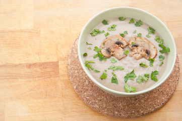 Hot cream soup with parsley.