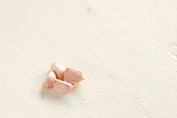 Close up garlic on white backdrop with copy space