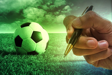 Football with football player hand to sign contract , soccer journalist