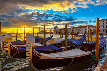 Fototapeta na wymiar Canal Grande with Venice gondola in Venice at sunrise, Italy