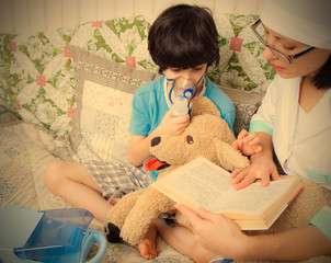 doctor pediatrician spends boy inhalation session