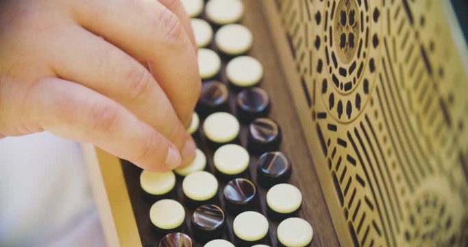 Close up slow motion shot man playing on accordion, musician hands.