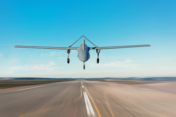 Unmanned military drone landing on runway military base.
