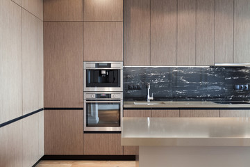 Fototapeta premium Modern and new kitchen with built in appliance