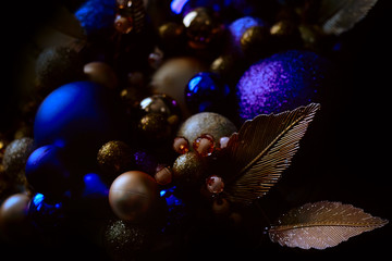 Blue and golden Christmas balls on a christmas tree closeup view in a low key with a copy space - 293417122