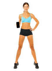 Cheerful young fitness woman showing blank smartphone screen isolated over white background