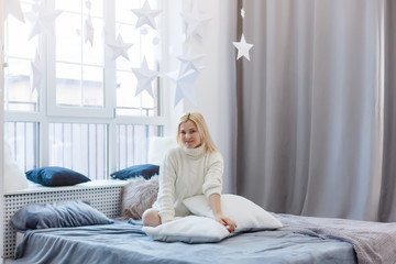 Relaxed young woman lying on couch