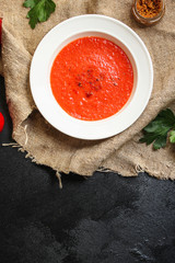 gazpacho, tomato or carrot soup with vegetables (delicious feather dish, healthy cooking) menu concept. food background. copy space. Top view