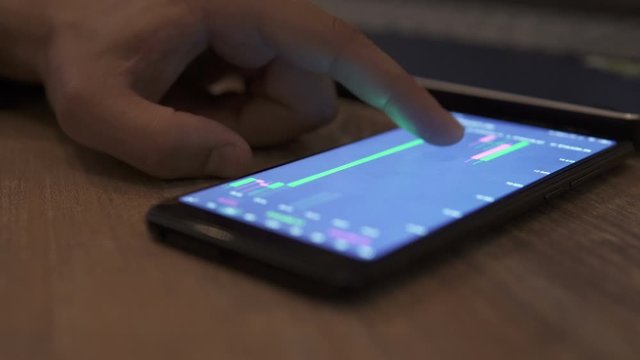 Block-chain, trading online, Cryptocurrency trend graph. Man touching screen, browse foreign exchange market data, chart. Forex. Crypto currency. Bitcoin cryptocurrency. Candle graph. investment